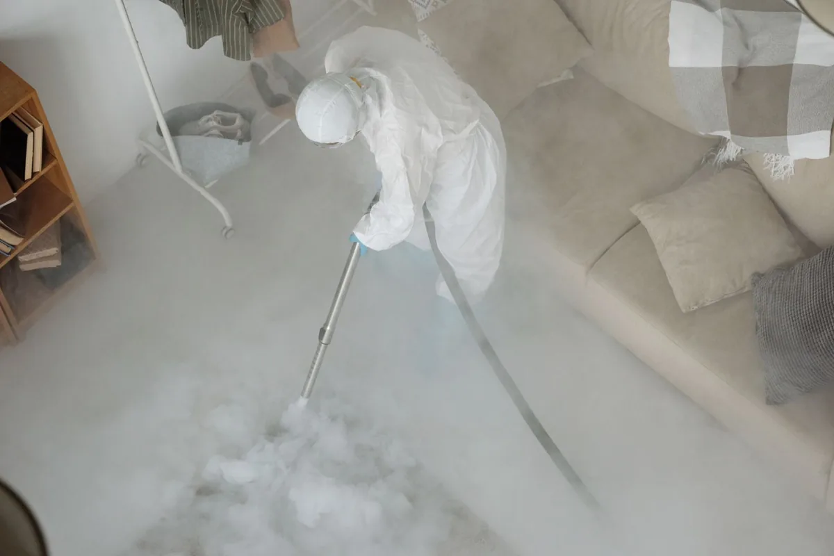 Biohazard cleanup technician in protective equipment, Stuart, VA